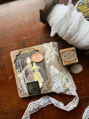 Vintage merchant rubber stamp and small round labels and lace junk journal from micmoc.com