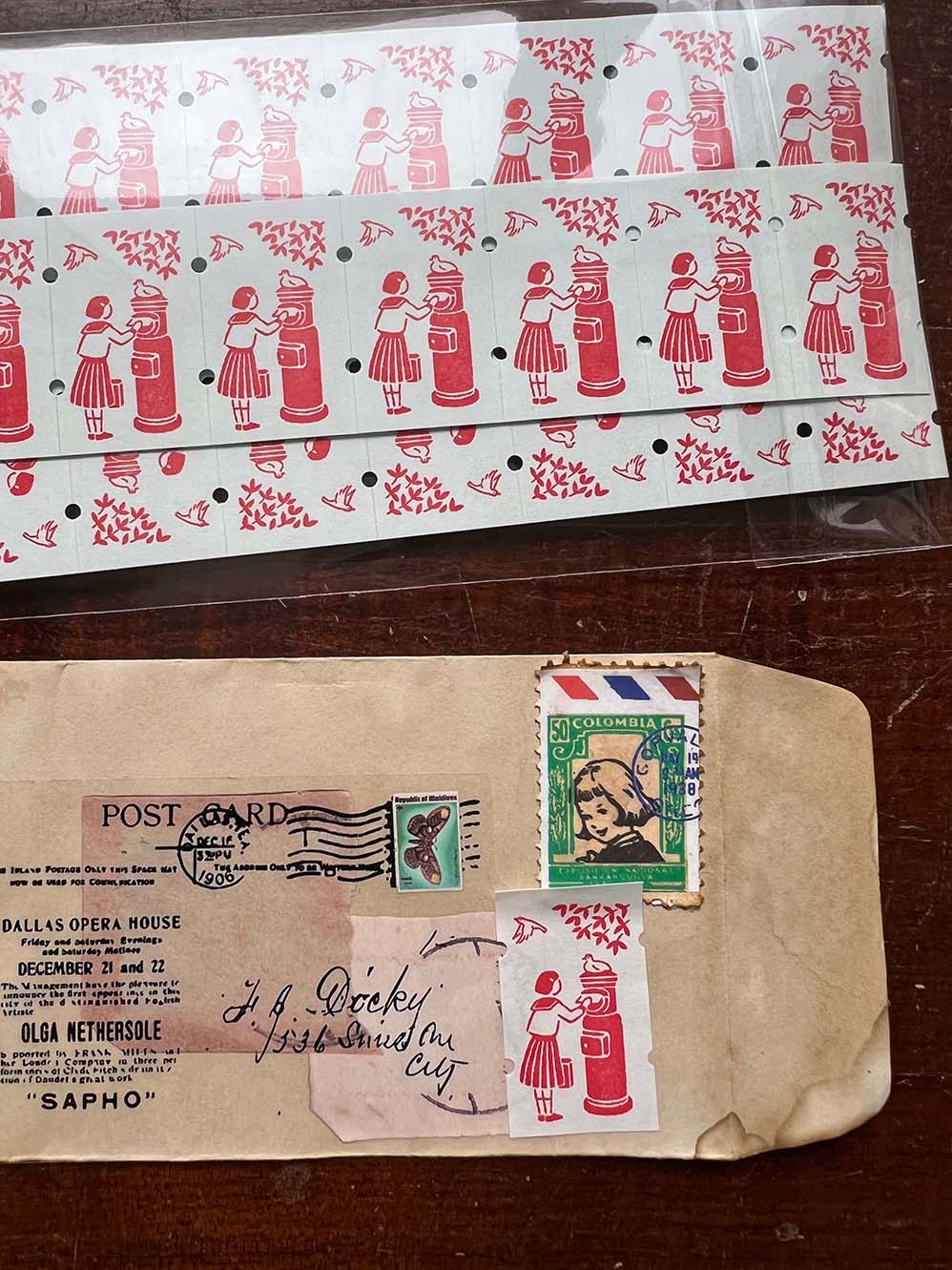 36 Sublo × Hana Rakui Label Ticket Roll Stickers: Postbox and Girl (Taster 30 pc) from micmoc.com - Vintage envelope with stamps and postcard on a wooden surface